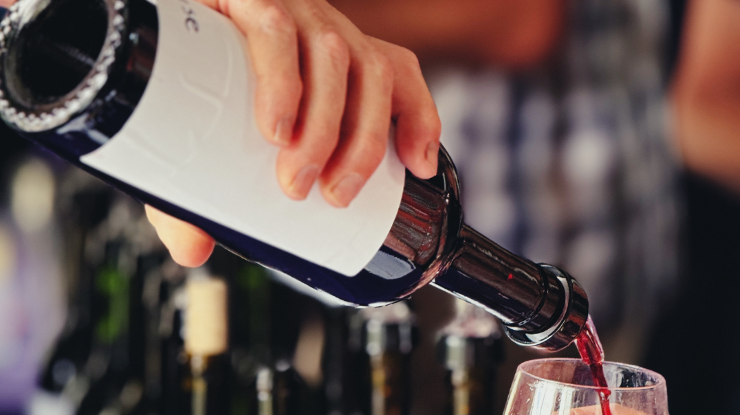 person pouring wine at Mendocino Wine Competition