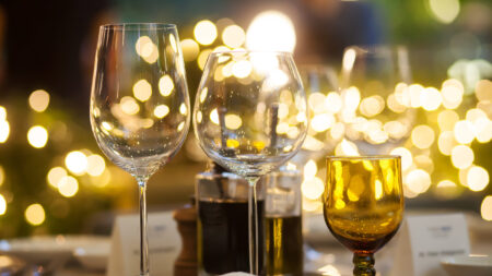 Blurry Background Of Wine Glass Set Up On The Table at a banquet.